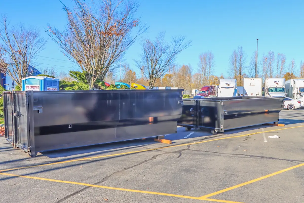 Professional dumpster rental service with roll-off container on residential driveway in Solana Beach